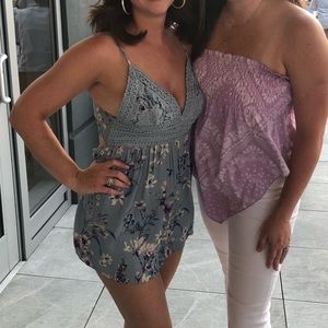 Floral blue romper with tie back. Only worn once